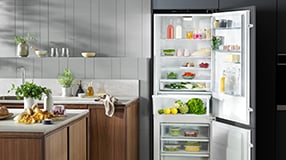 Open fridge freezer in kitchen